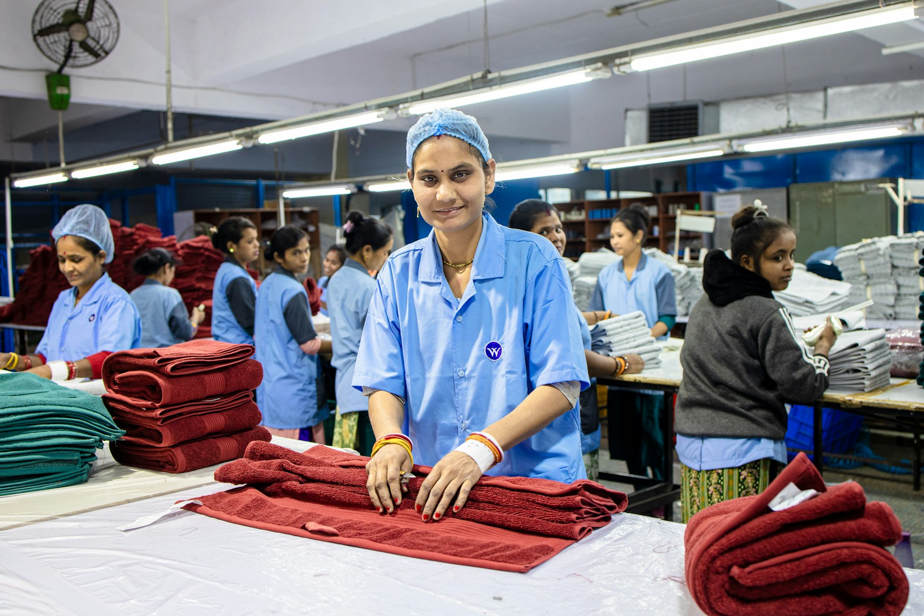 A Nash and Vance team member walking a factory floor with a partner